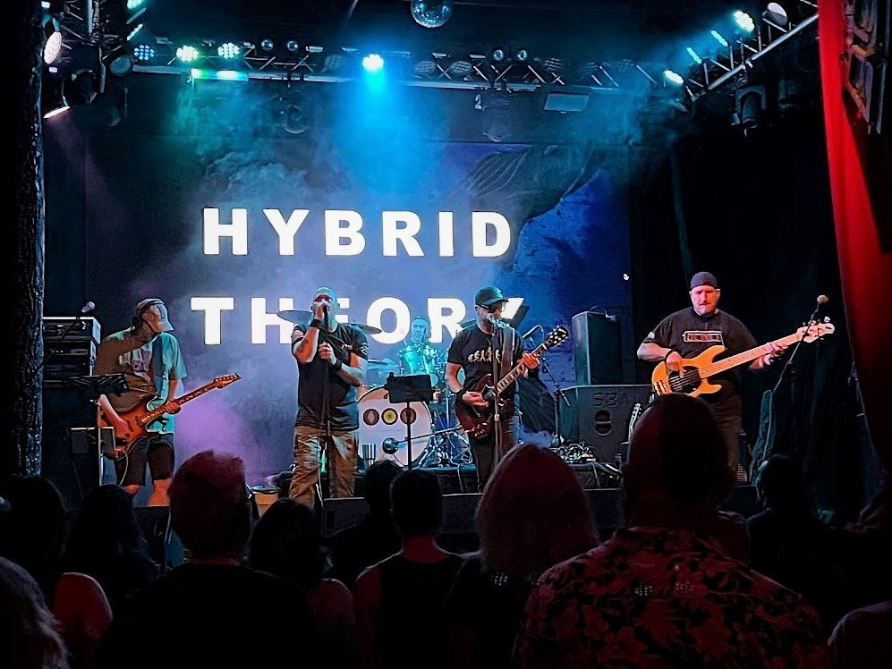 representation of Halloween Bash with Hybrid Theory at T’s Bar & Grill