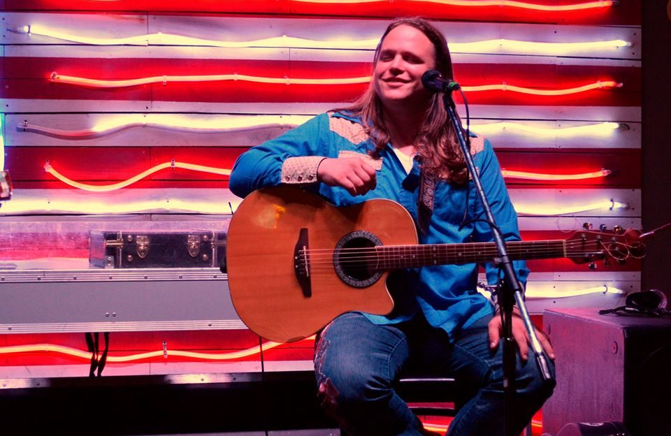 Joe Savage playing guitar