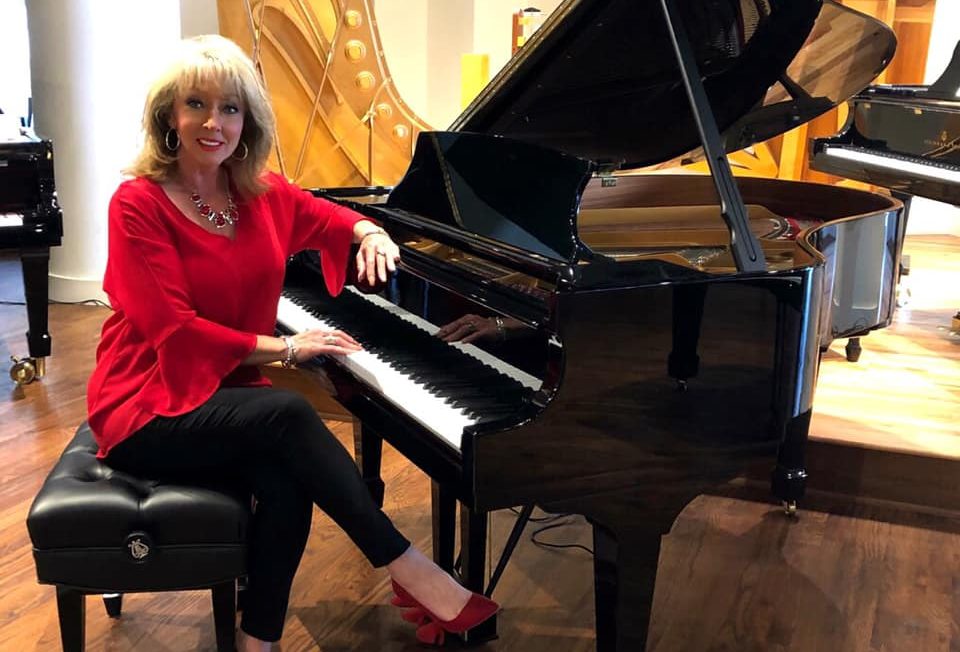 Tammy Smith posing at piano