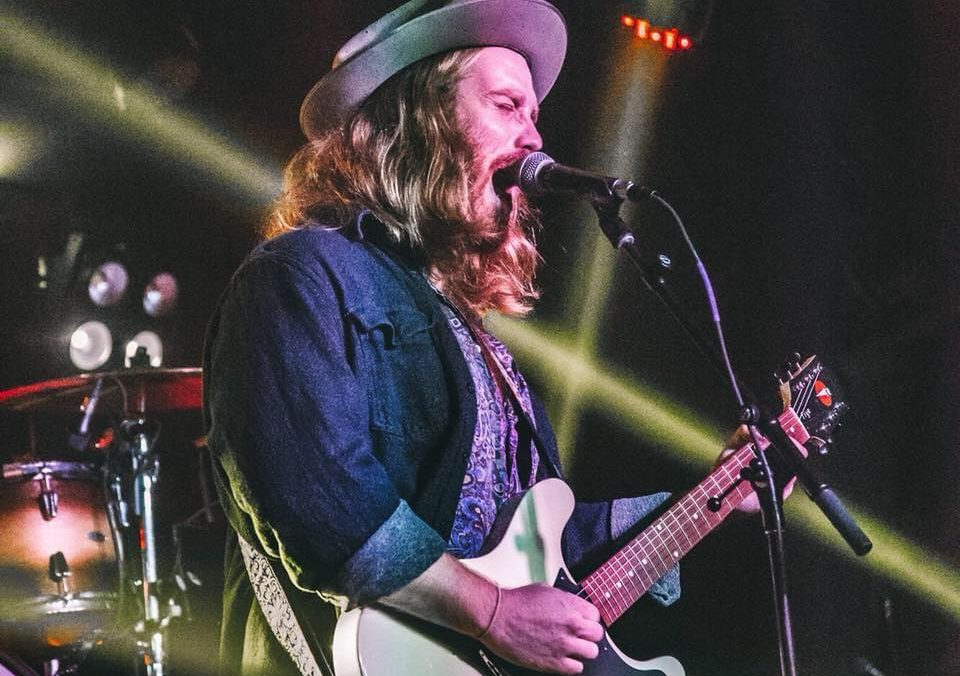 Guitarist singing on stage