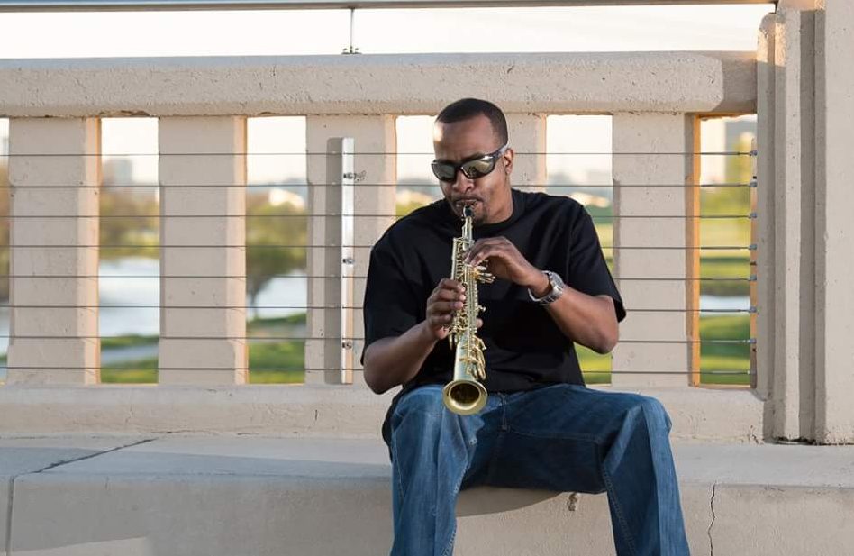 Jazz musician sitting outside