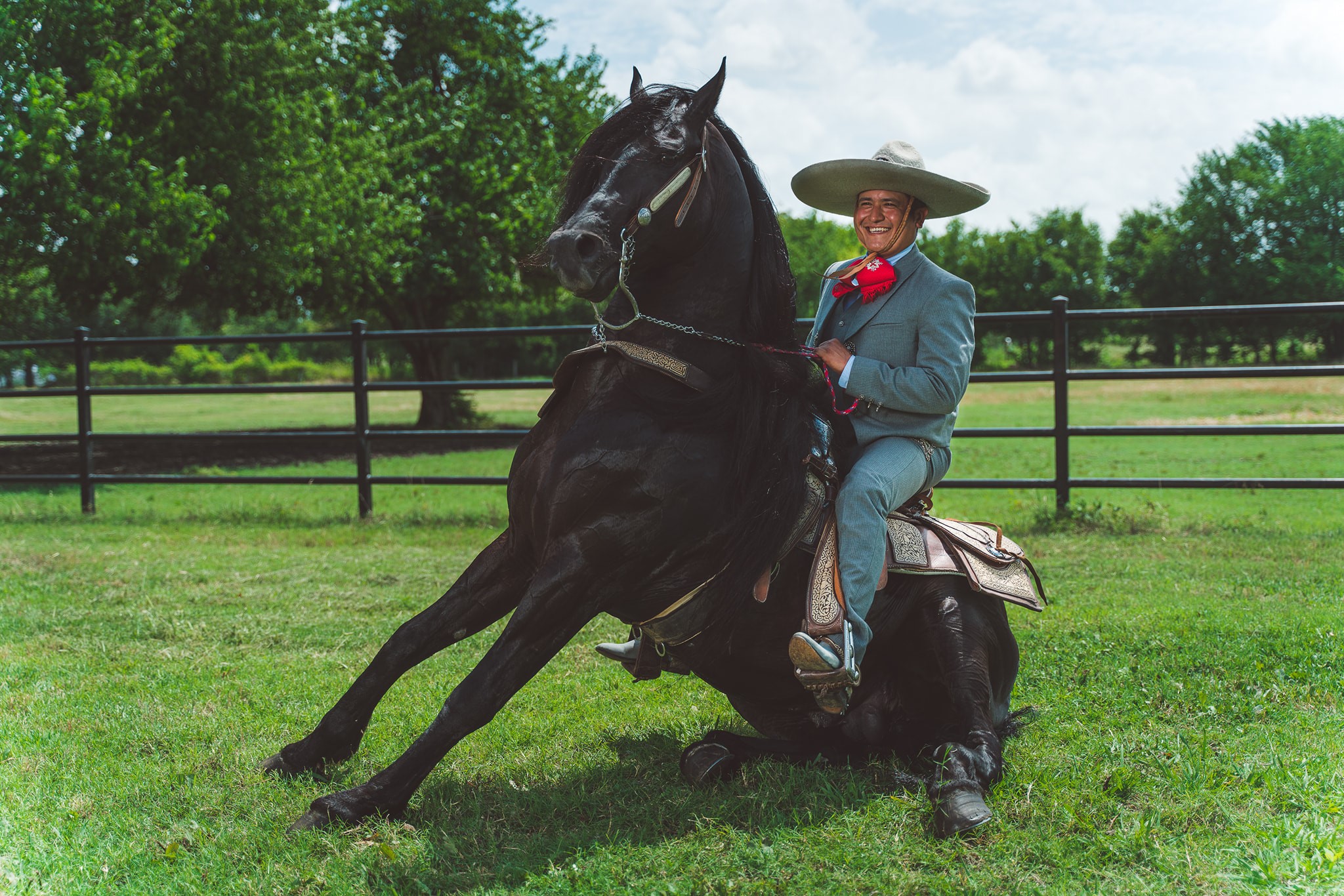 Male musician posing on horse at rodeo