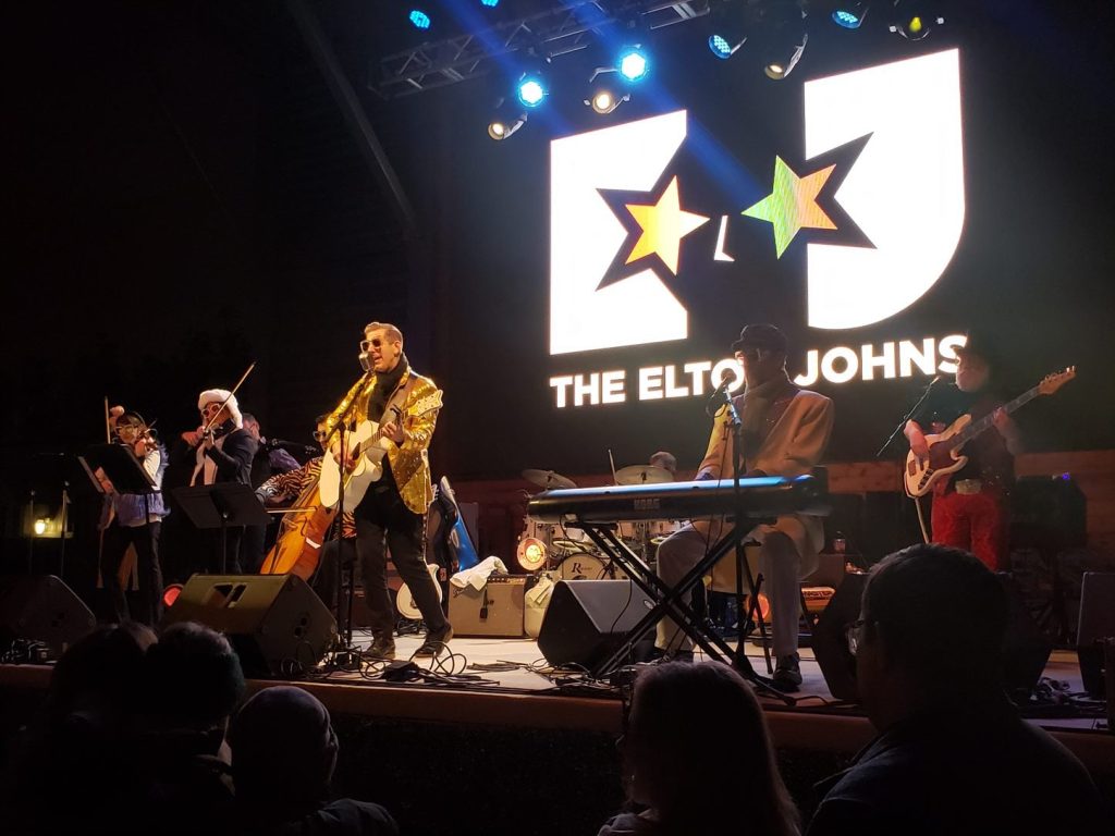 representation of Sounds of Lewisville: The Elton Johns at Wayne Ferguson Plaza